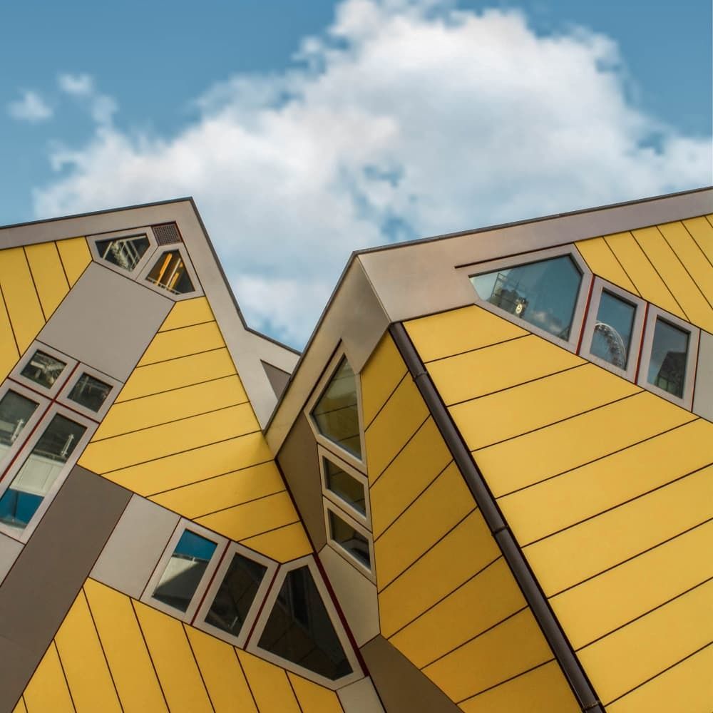 Interesting yellow buildings that appear to be leaning to one side