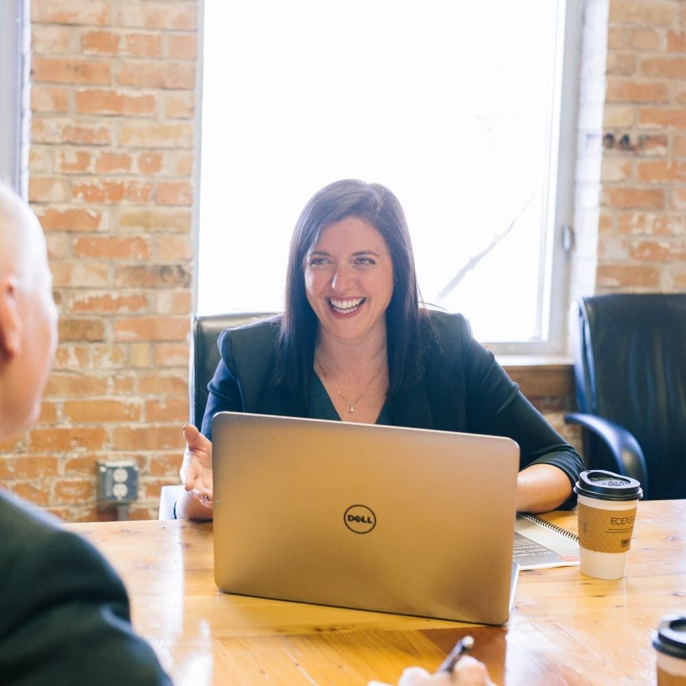 Smiling woman in business meeting