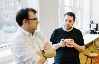 two Capsule team members having a casual chat.